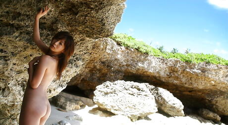 Stunning japanese young Honoka bares small tits and sexy butt at beach