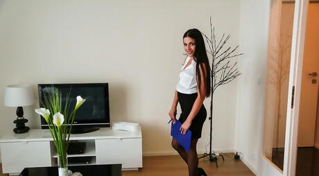 Stunning czech dark-haired cutie Eveline Dellai in nice skirt exposing her ass and pussy in the kitchen