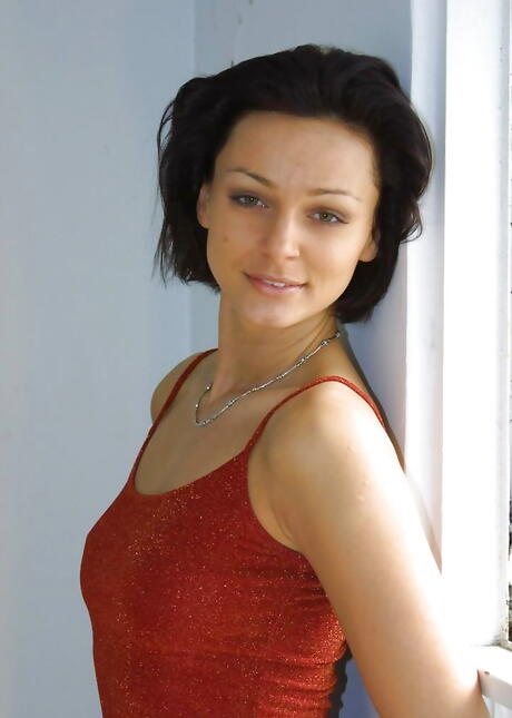 Stunning brunette youthful Mona baring big hooters and spreading her legs 